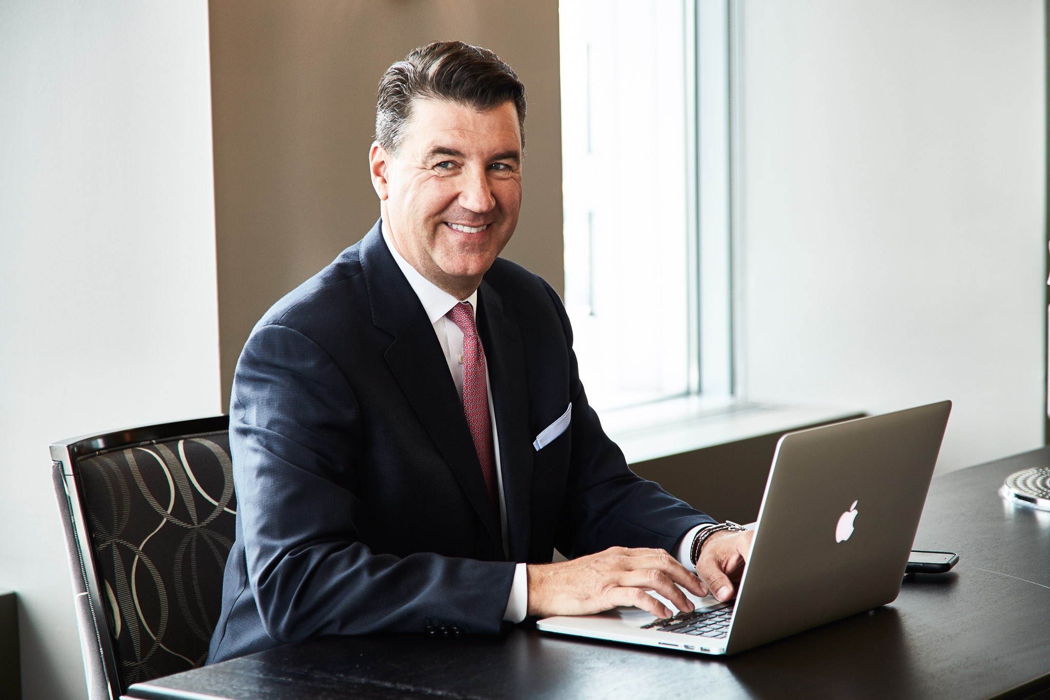 Man working on laptop at club